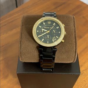 Black and gold Authentic Michael kors watch.